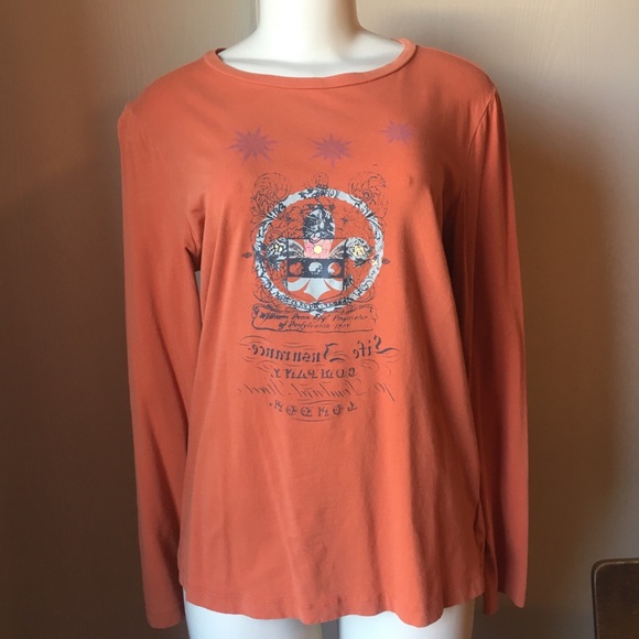 CAbi Tops - Long sleeve cabi graphic tee in rusty orange. CAbi Tops - Long sleeve cabi graphic tee in rusty orange.